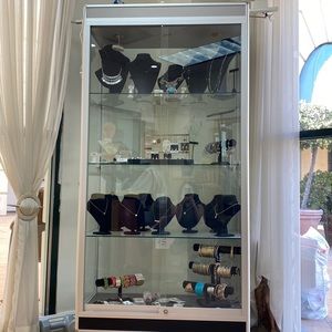 Glass double door show case and hair dryer chair in a brand new condition